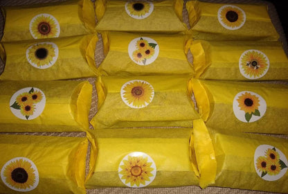 Product will come wrapped in yellow tissue paper and sealed with a sunflower sticker